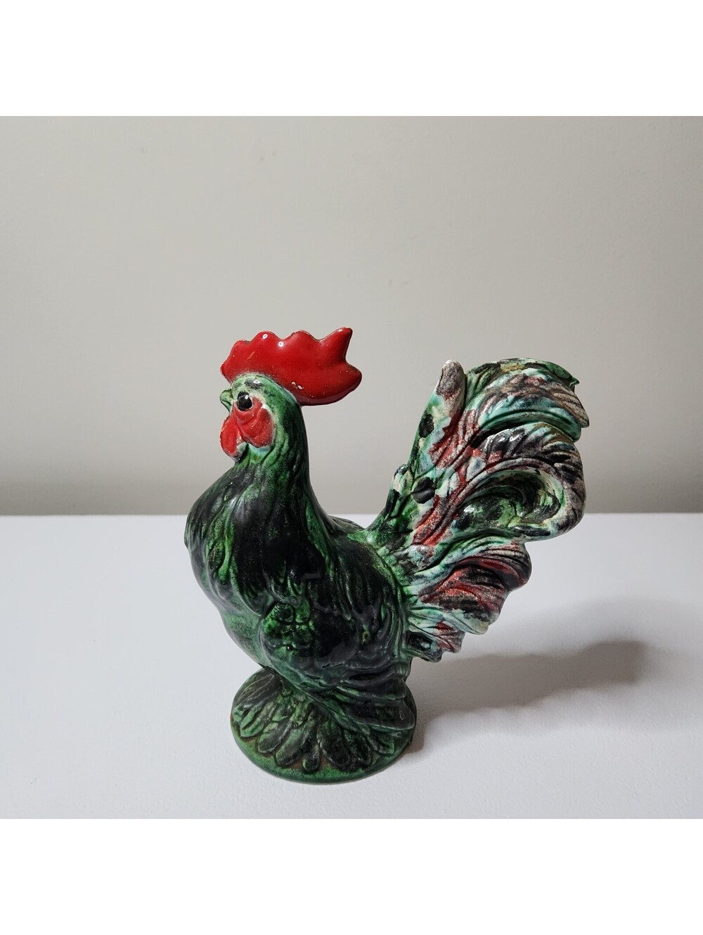 Green ceramic rooster figurine